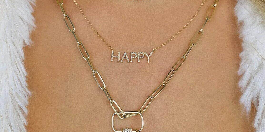 Layered charm necklaces featuring 'Happy' and 'Karma' pendants, perfect for elevating your style.