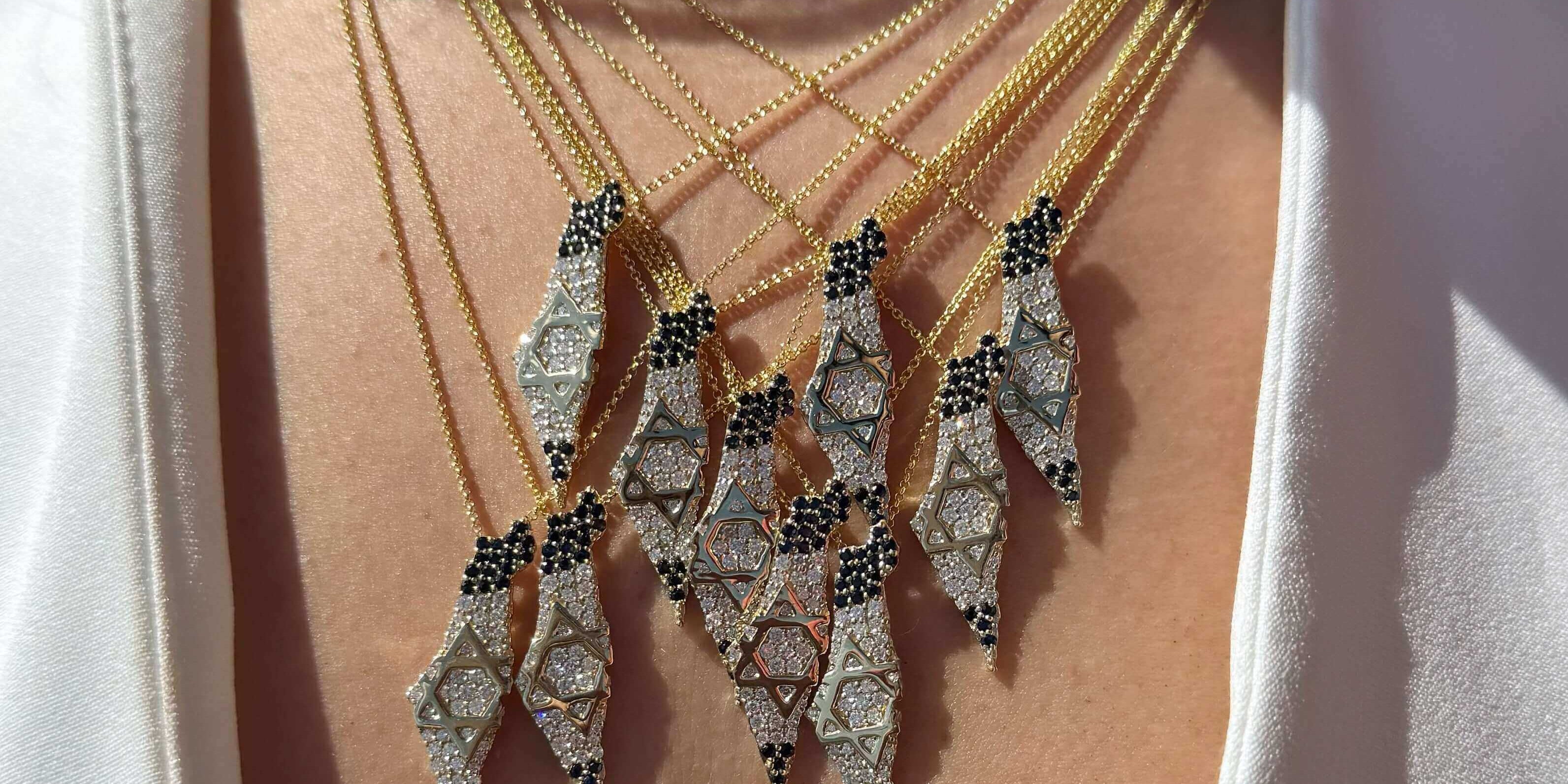 Stunning layered necklaces featuring unique Star of David pendants on gold chains, perfect for any occasion.