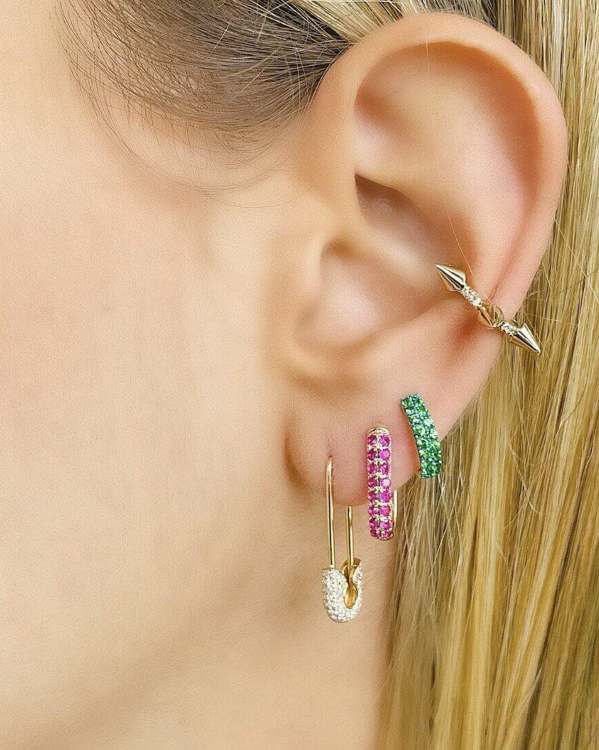 Model wearing Medium Micro Pave Diamond Safety Pin Earrings and colorful additional piercings from Izakov Fine Jewelry.