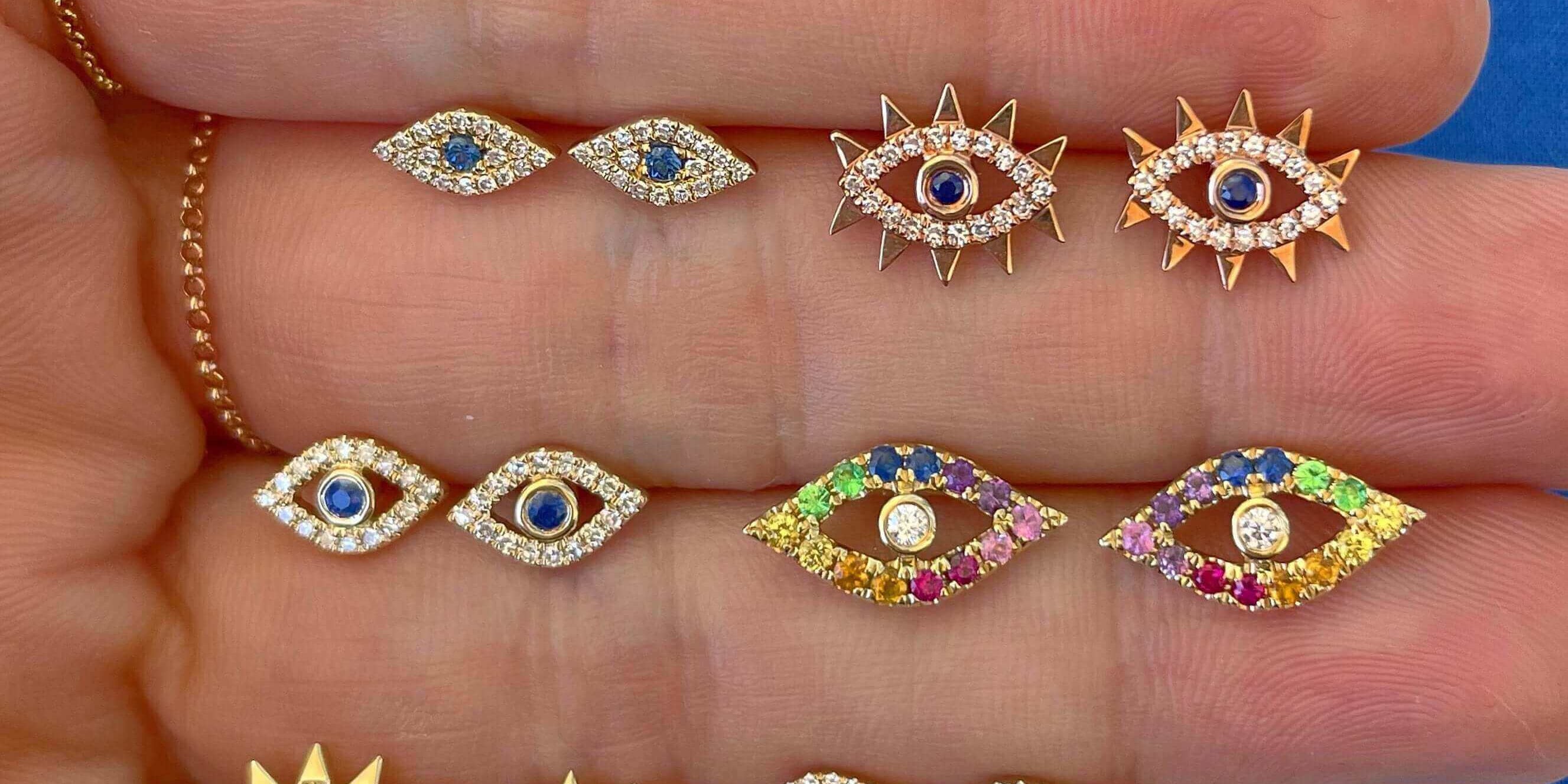 button earrings worn by an Izakov model