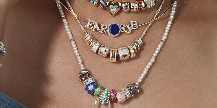 Stylish Rondelles necklaces layered on a model, featuring colorful beads and charms.