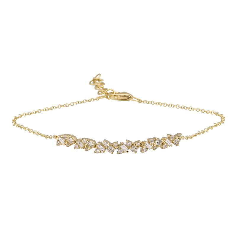 Baguette & Round Diamond Cluster Bracelet featuring a gold chain with baguette and round diamonds in a cluster design.