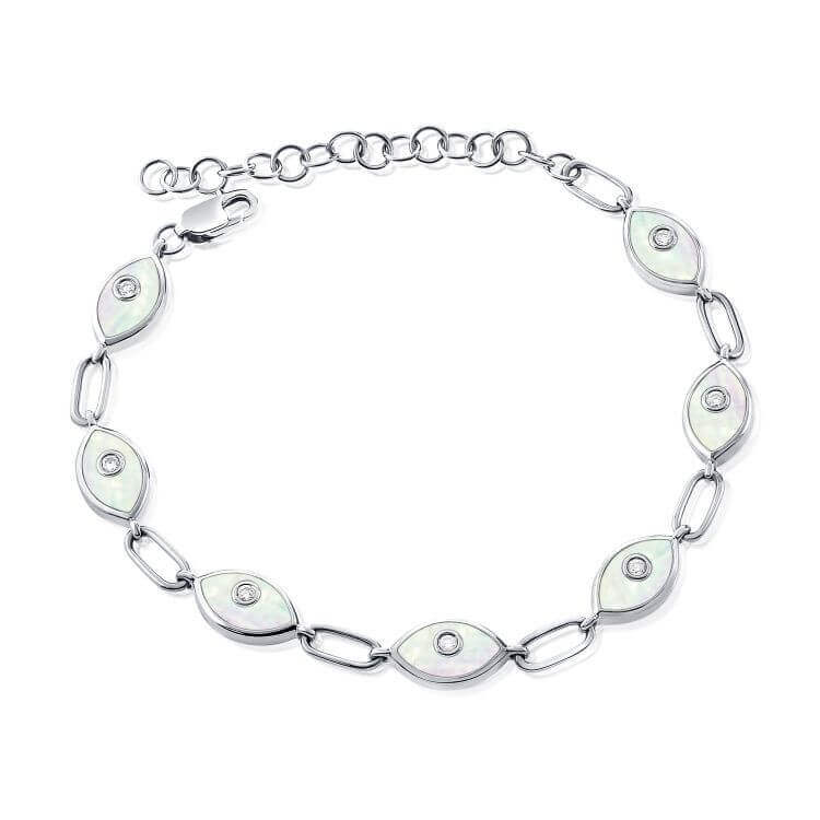 Elegant silver bracelet with eye-shaped links and sparkling stones, perfect for adding a touch of sophistication to any outfit.