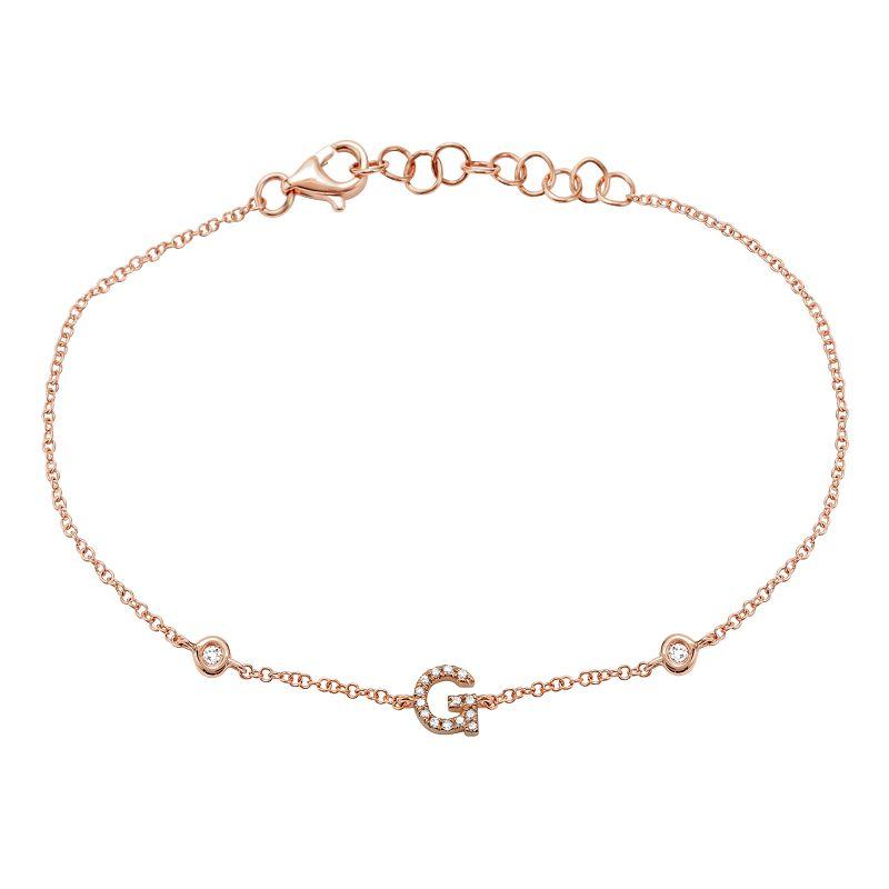 Delicate rose gold bracelet with letter G initial charm and sparkling gemstones.