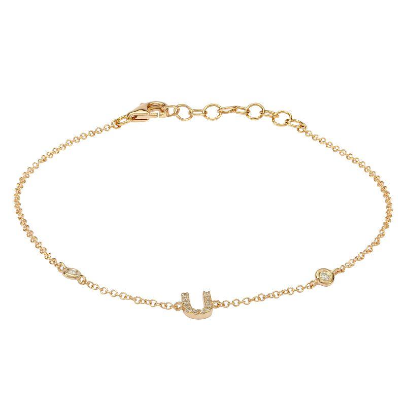 Delicate gold bracelet with letter U charm from our exclusive jewelry collection.