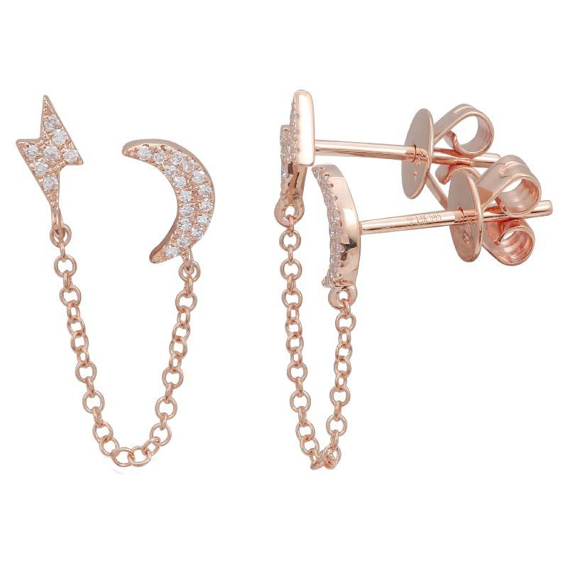 Rose gold moon and lightning bolt earrings with diamond accents and chain design by our luxury jewelry brand.