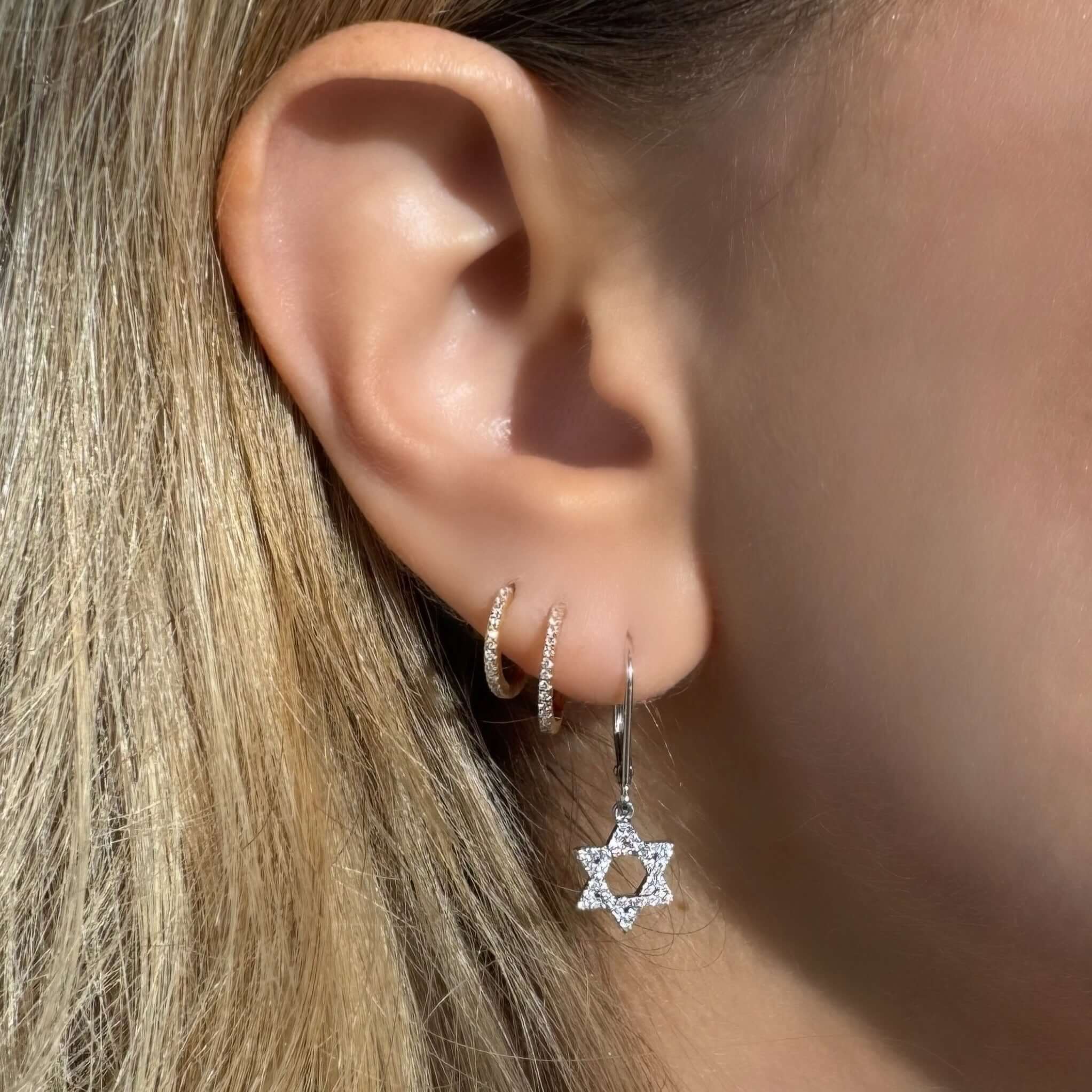 14K gold diamond Star of David leverback drop earrings worn, showcasing elegance and faith in jewelry.