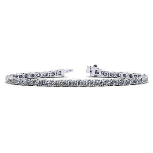 Elegant diamond tennis bracelet in white gold by our jewelry brand, featuring sparkling round-cut diamonds for a timeless, luxurious look.