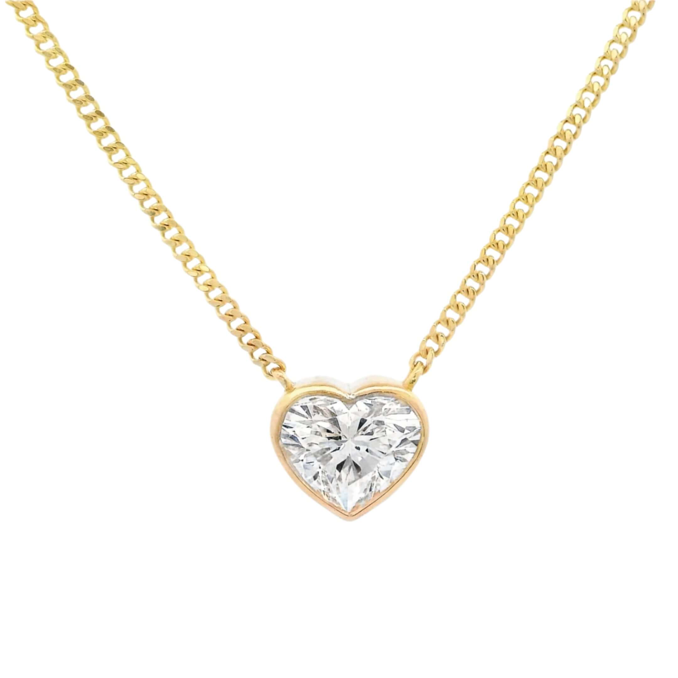 14K gold necklace with heart shaped diamond in a floating bezel setting on a classic chain.