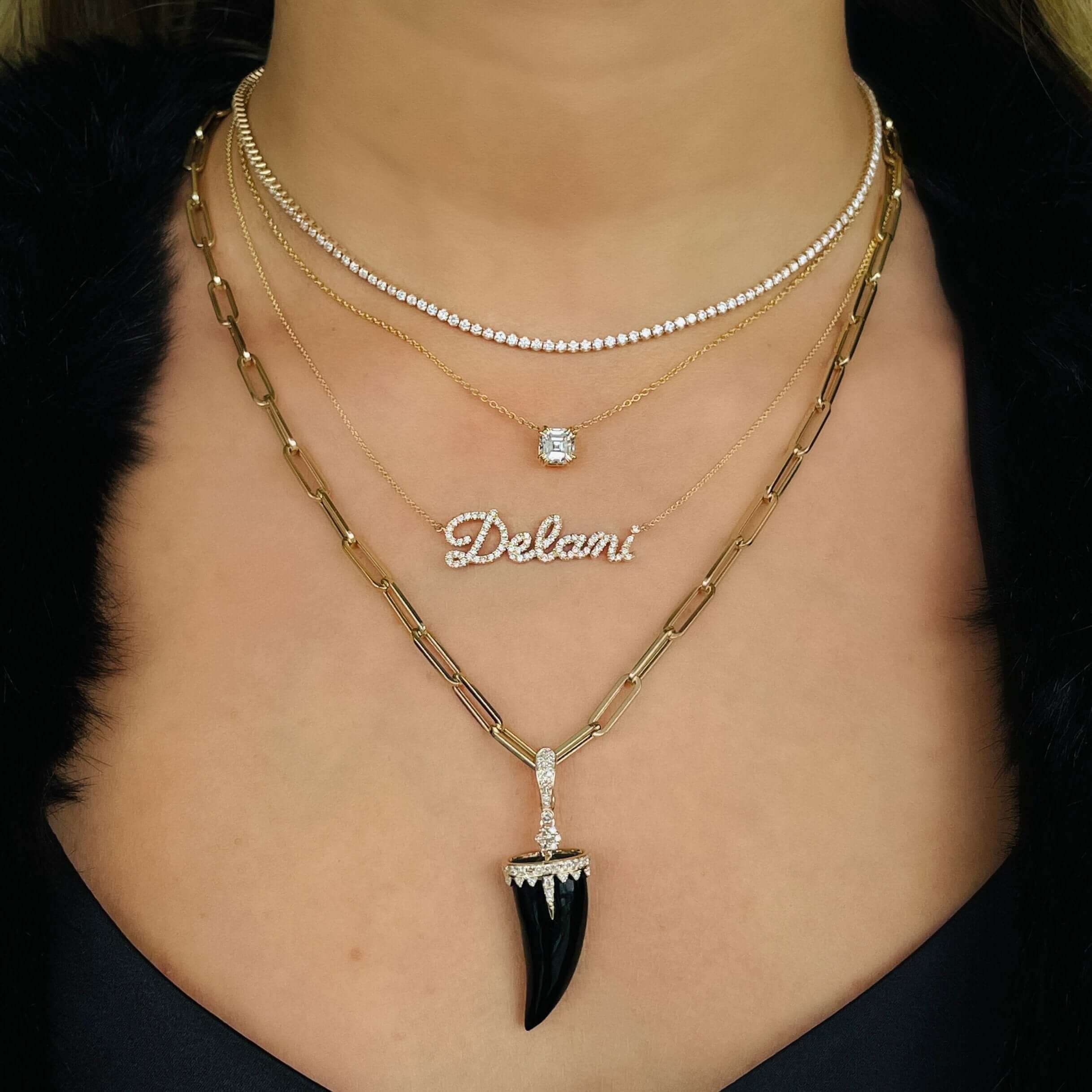 14K Gold Floating Solitaire Lab-Grown Diamond Necklace layered with other gold chains and pendants