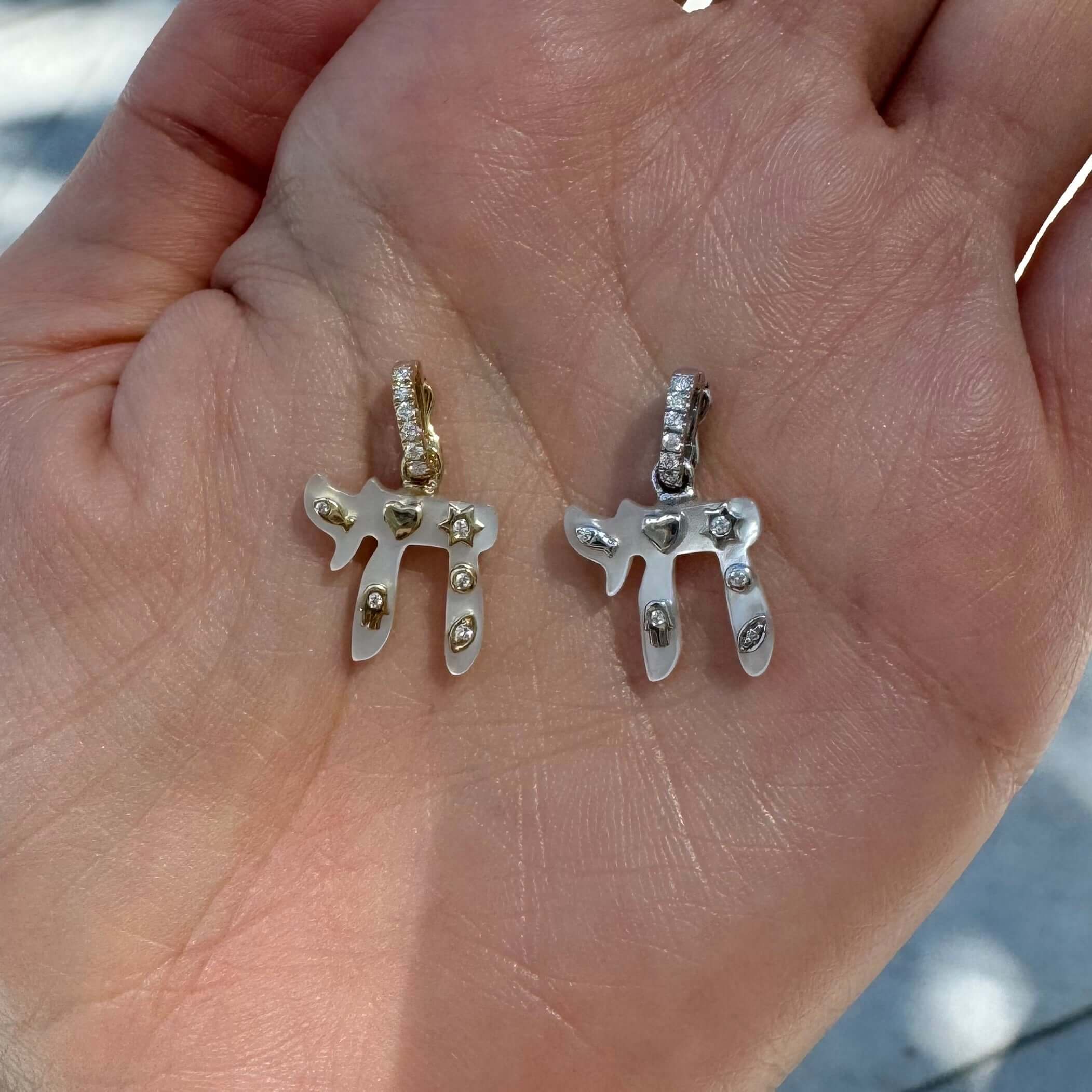 14K Gold Jewish Charms Chai Gemstone Pendant © featuring gold and silver chai charms with diamond accents.