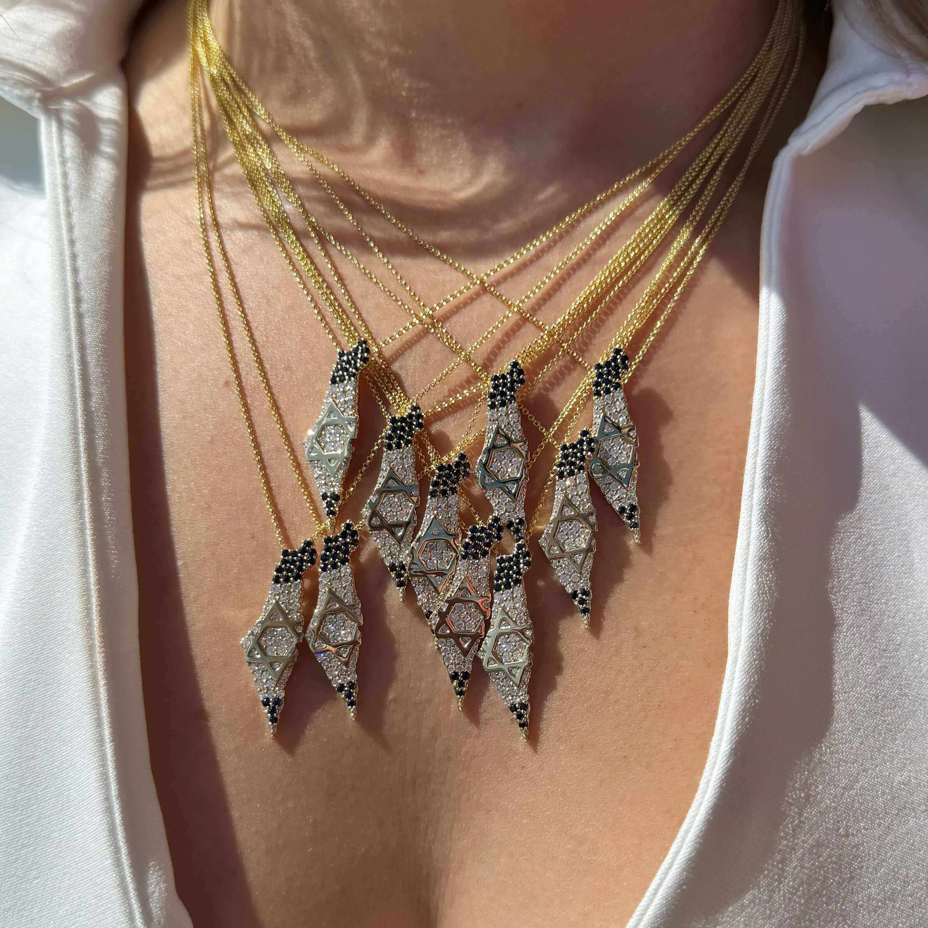 Land Of Israel Map Diamond & Sapphire Pendant © showcased in a stunning layered necklace by Izakov Fine Jewelry.