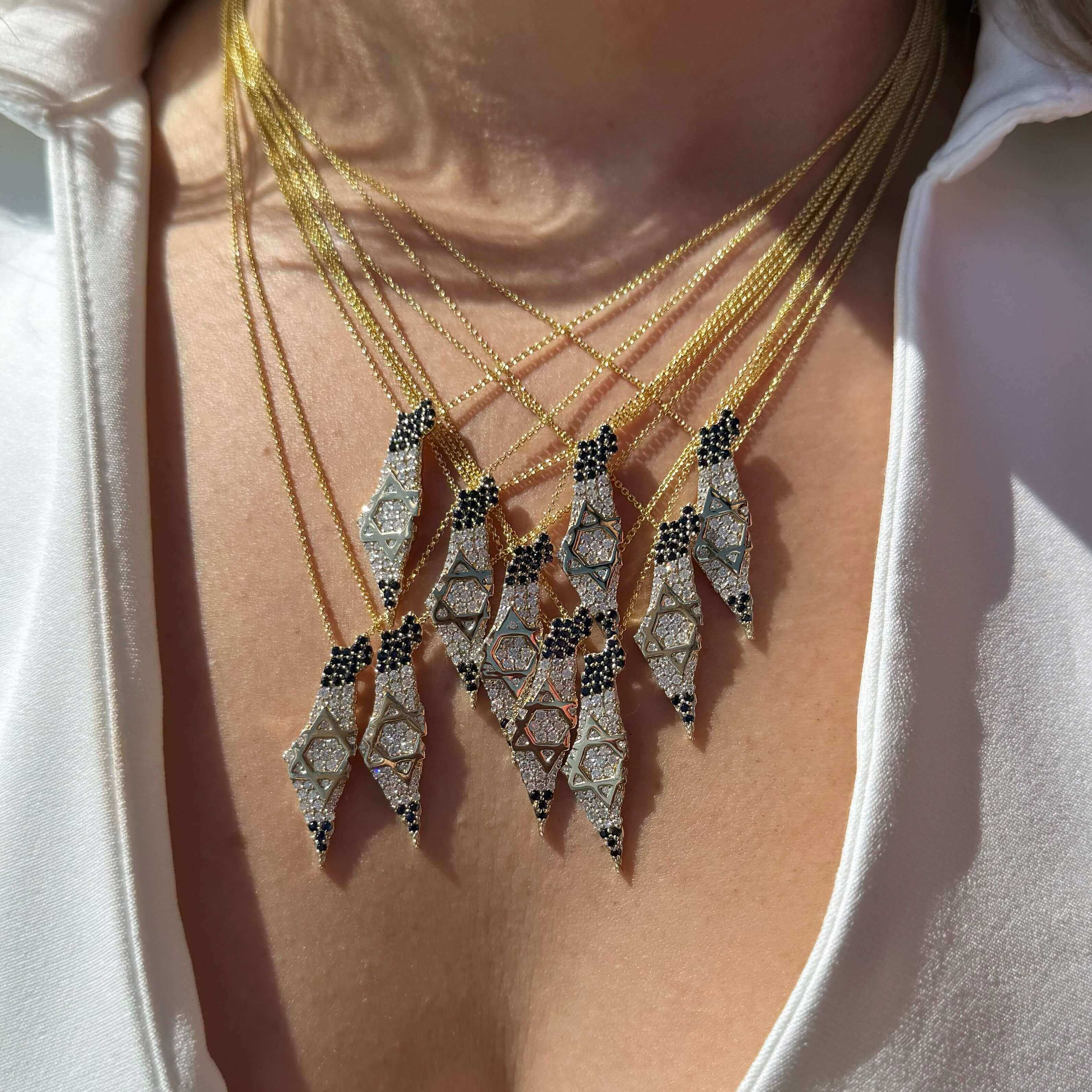 Land Of Israel Map Diamond & Sapphire Pendant © showcased in a stunning layered necklace by Izakov Fine Jewelry.