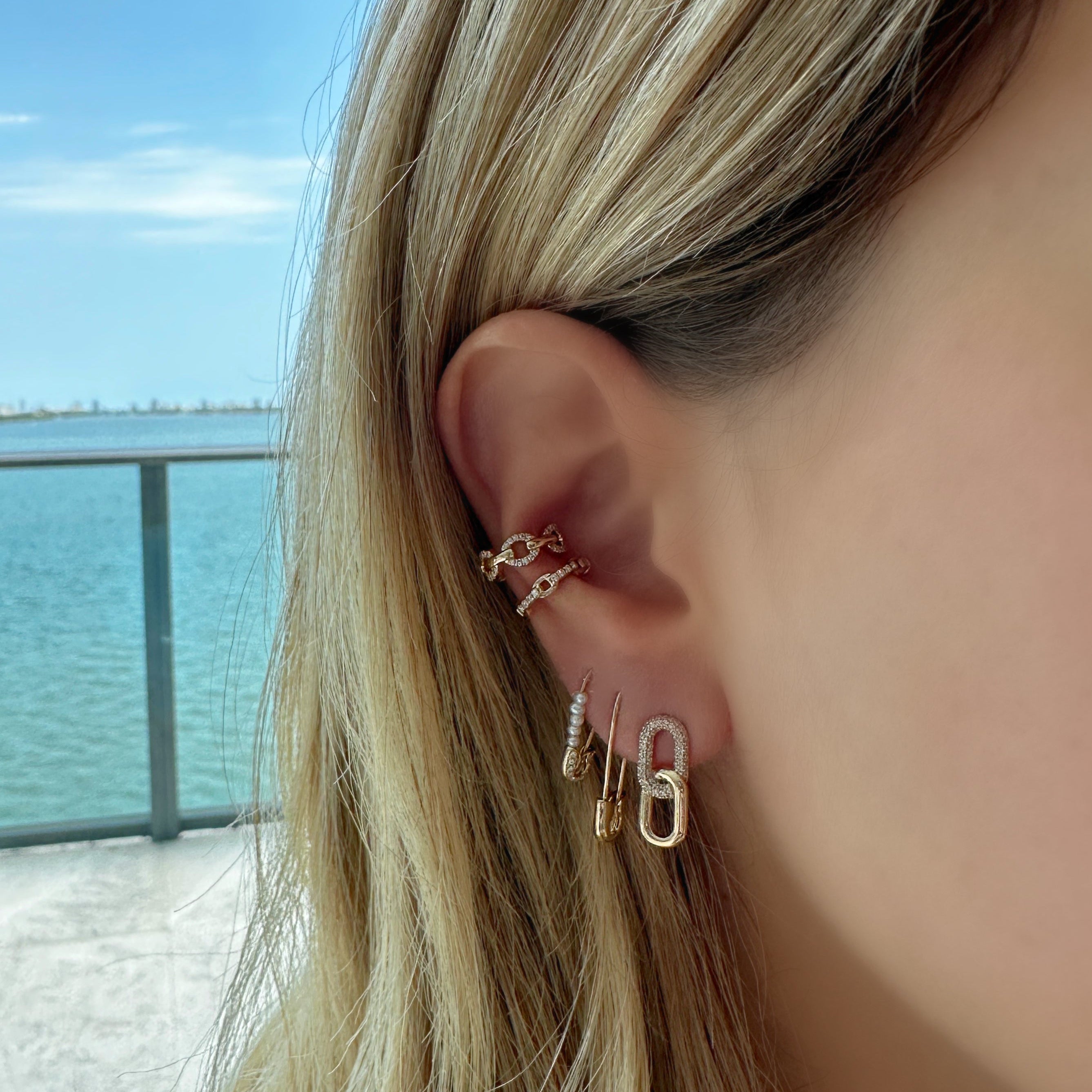 Medium Safety Pin Gold Earrings close-up, gold