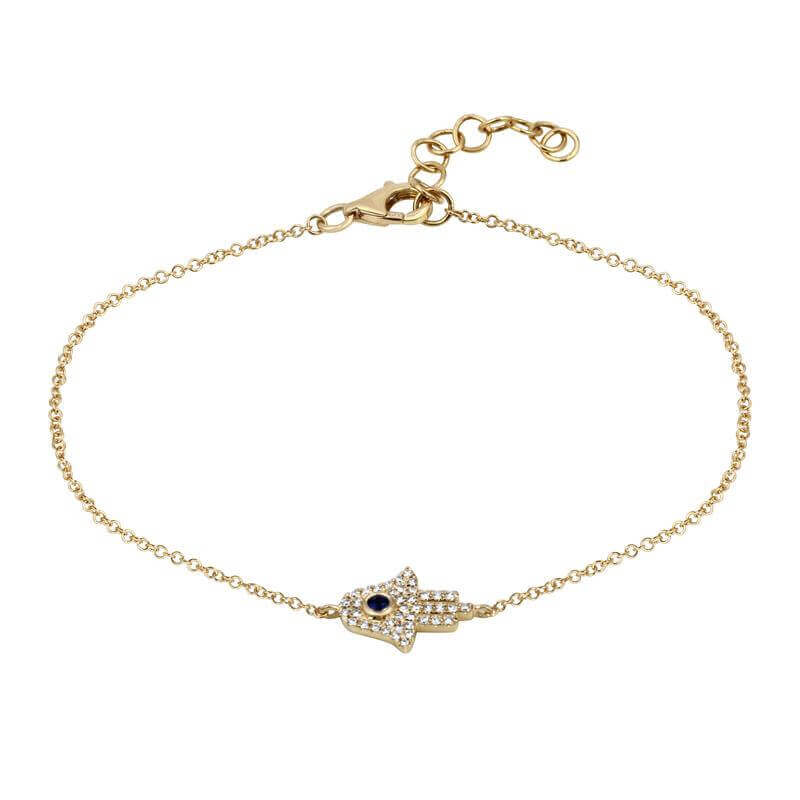 Delicate gold bracelet with Hamsa hand charm featuring pave diamonds and a sapphire, elegant jewelry piece for protection and style.