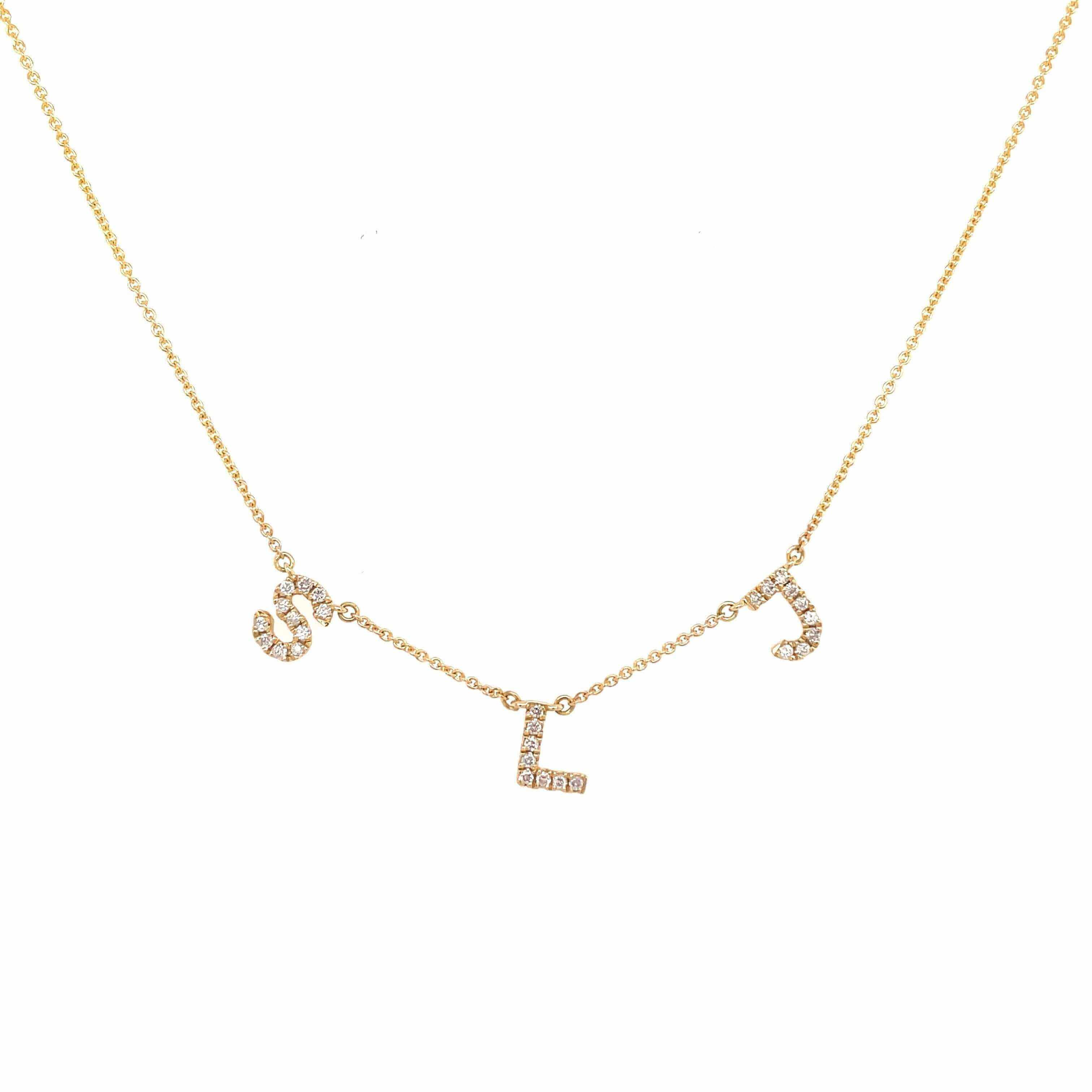 Gold necklace with S, L, and J diamond letter charms from our exclusive jewelry collection.