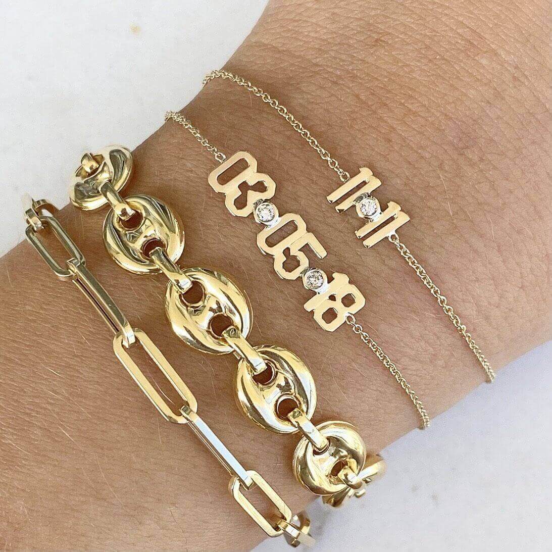 Stylish gold bracelets with unique designs from our jewelry brand, showcasing delicate chains and intricate link details.