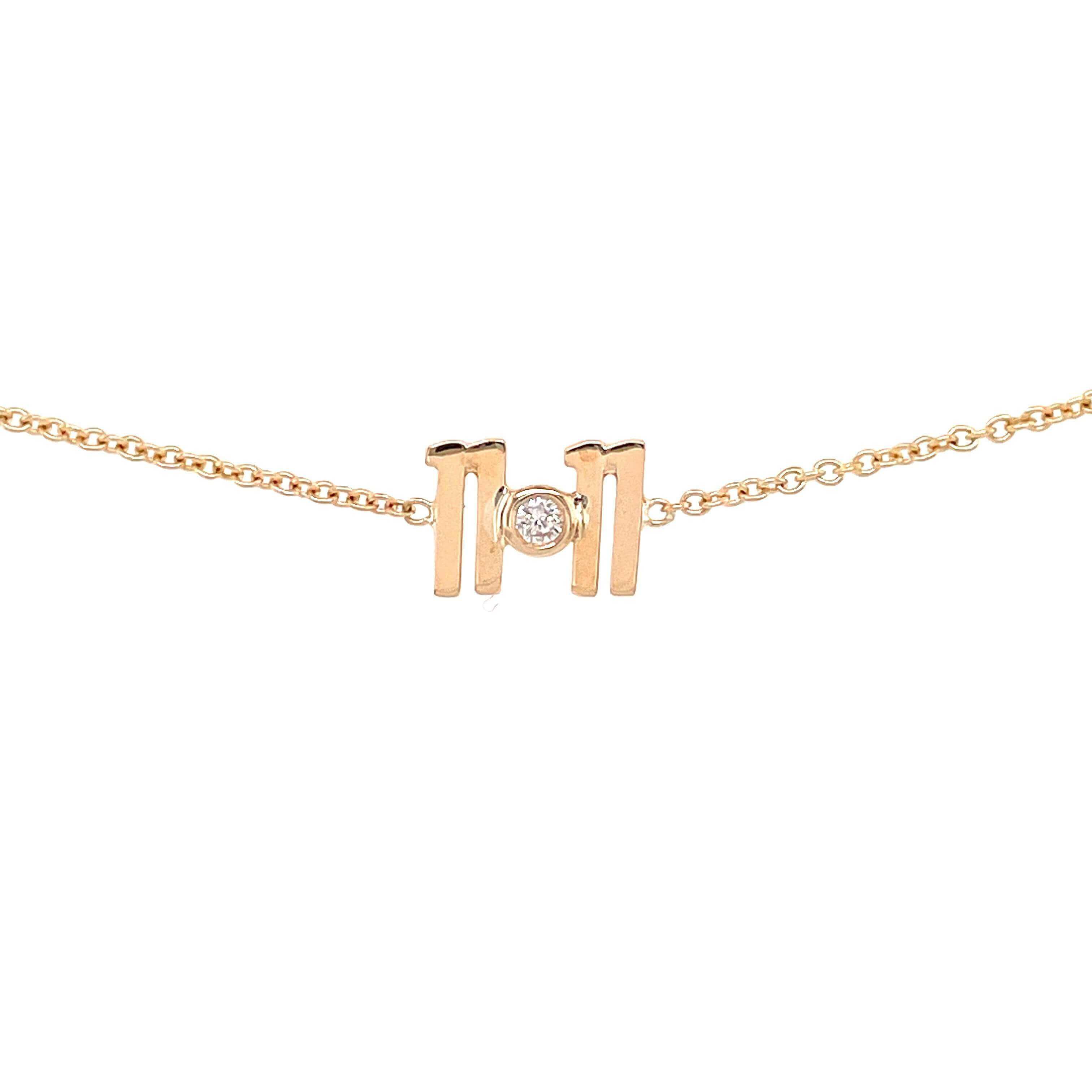 Delicate gold necklace with diamond-encrusted letter "M" pendant from our luxury jewelry collection