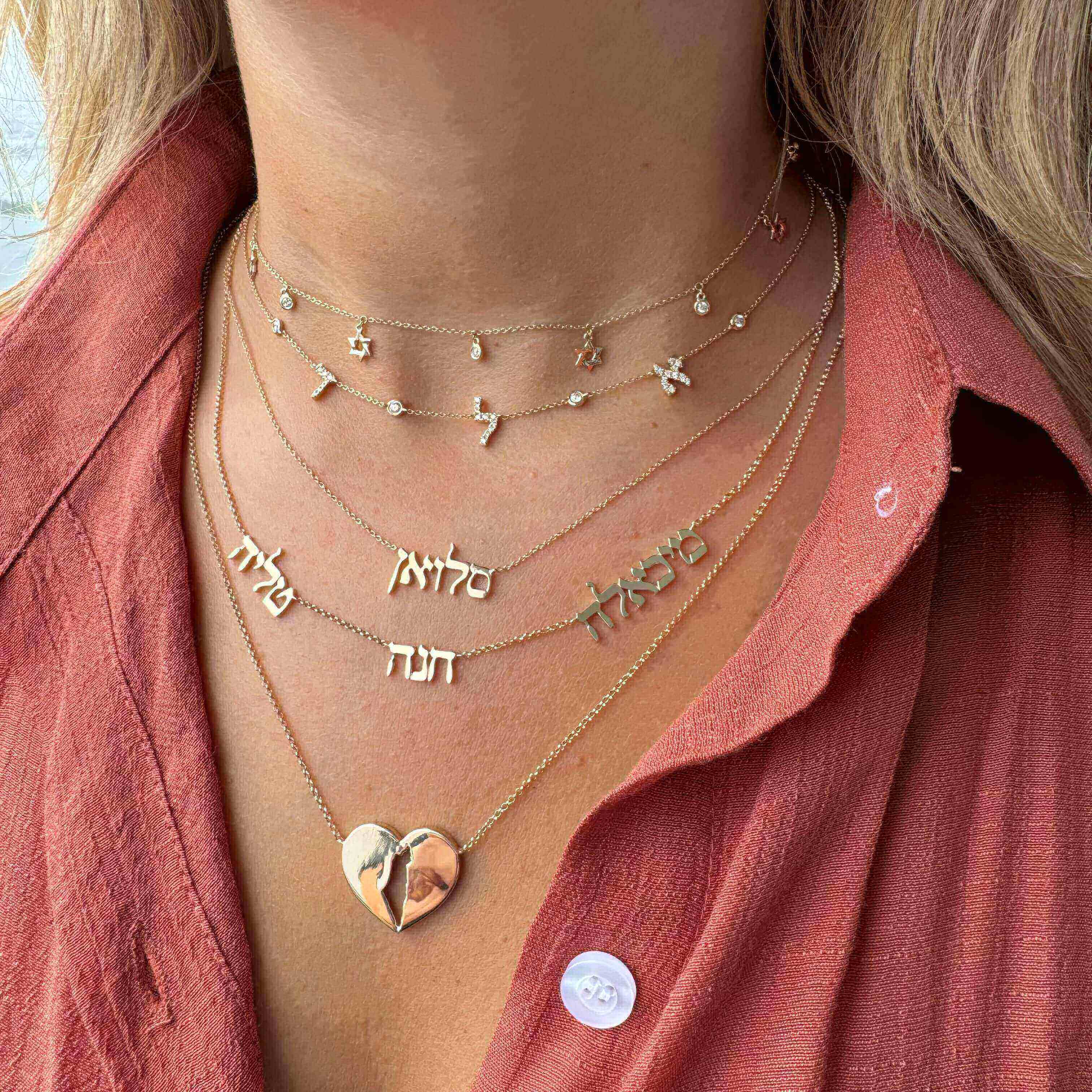 Personalized Pave Hebrew Diamond Bezel Station Necklace displayed on a model, featuring gold and Hebrew letters.