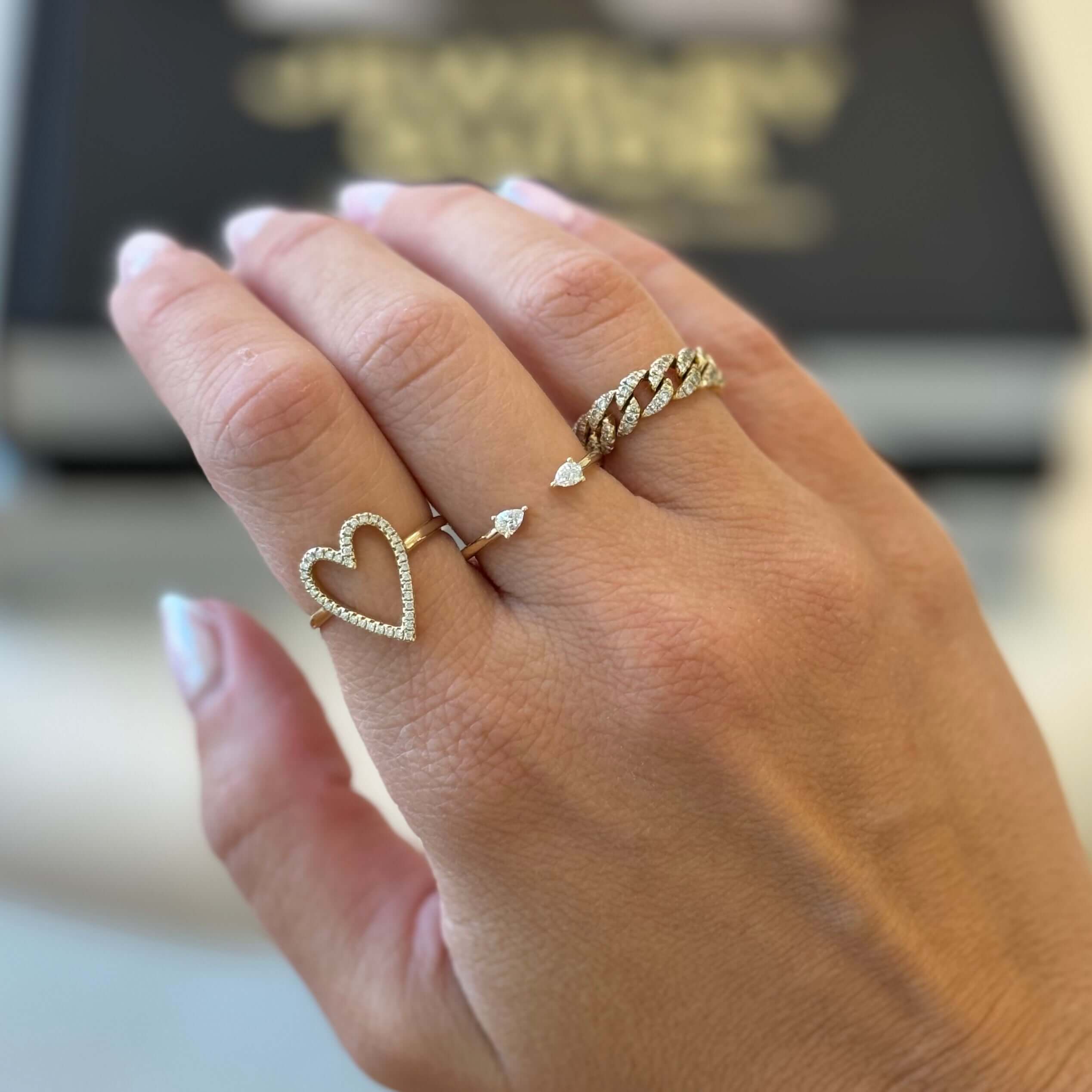 14K Gold Petite Toi et Moi Pear Diamonds Open Ring worn alongside heart and twisted diamond rings on hand.