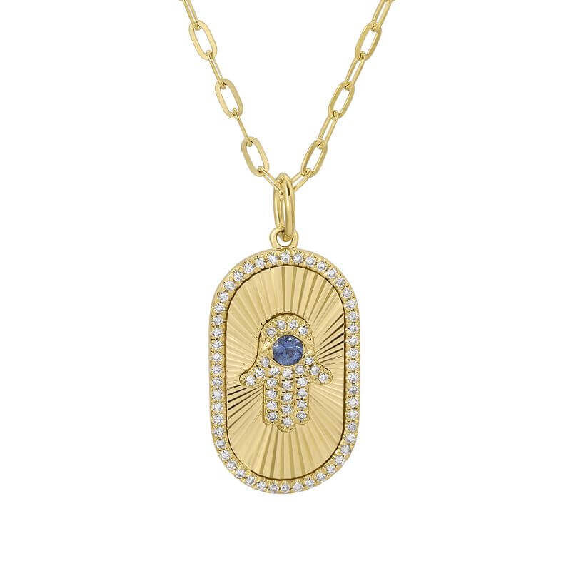 Gold necklace with Hamsa pendant featuring diamonds and a blue gemstone from our luxury jewelry collection.