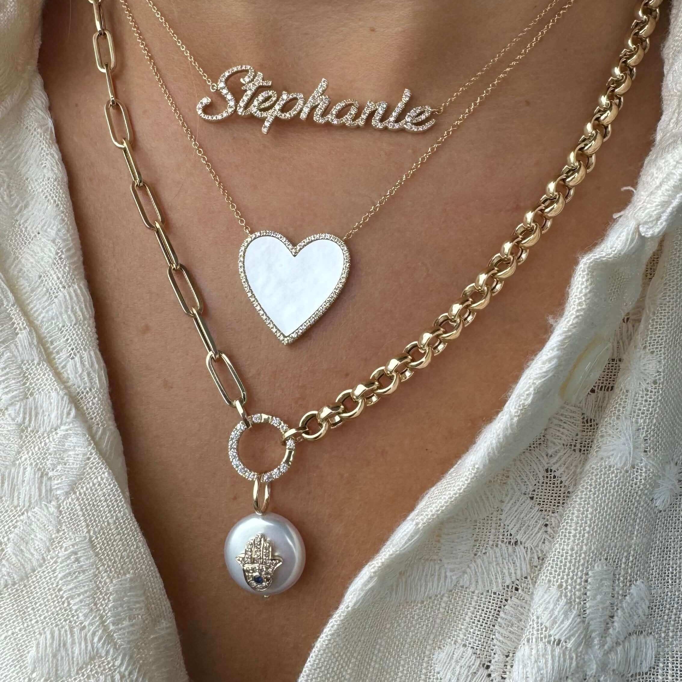 Round Link Diamond Charm Enhancer paired with necklaces including a heart pendant and name charm from Izakov Fine Jewelry.