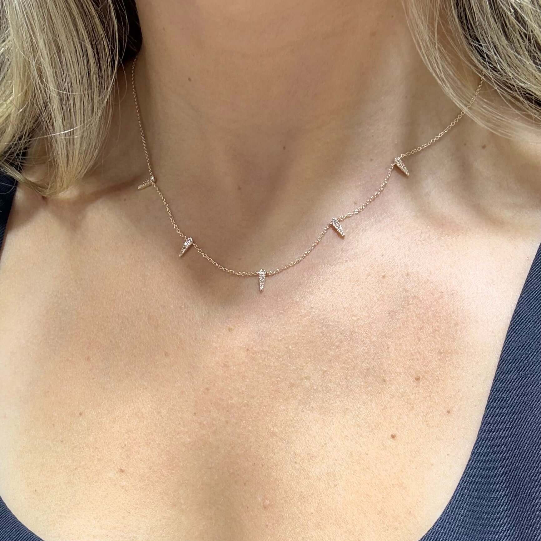 14K Gold Spike Stations Diamond Necklace featuring diamond-adorned spikes on a delicate chain.