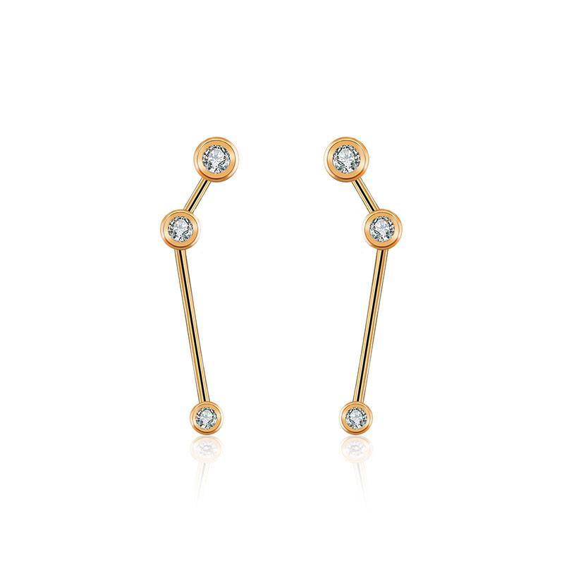 18K gold zodiac constellation diamond earrings showcasing elegant celestial designs and sparkling diamonds.