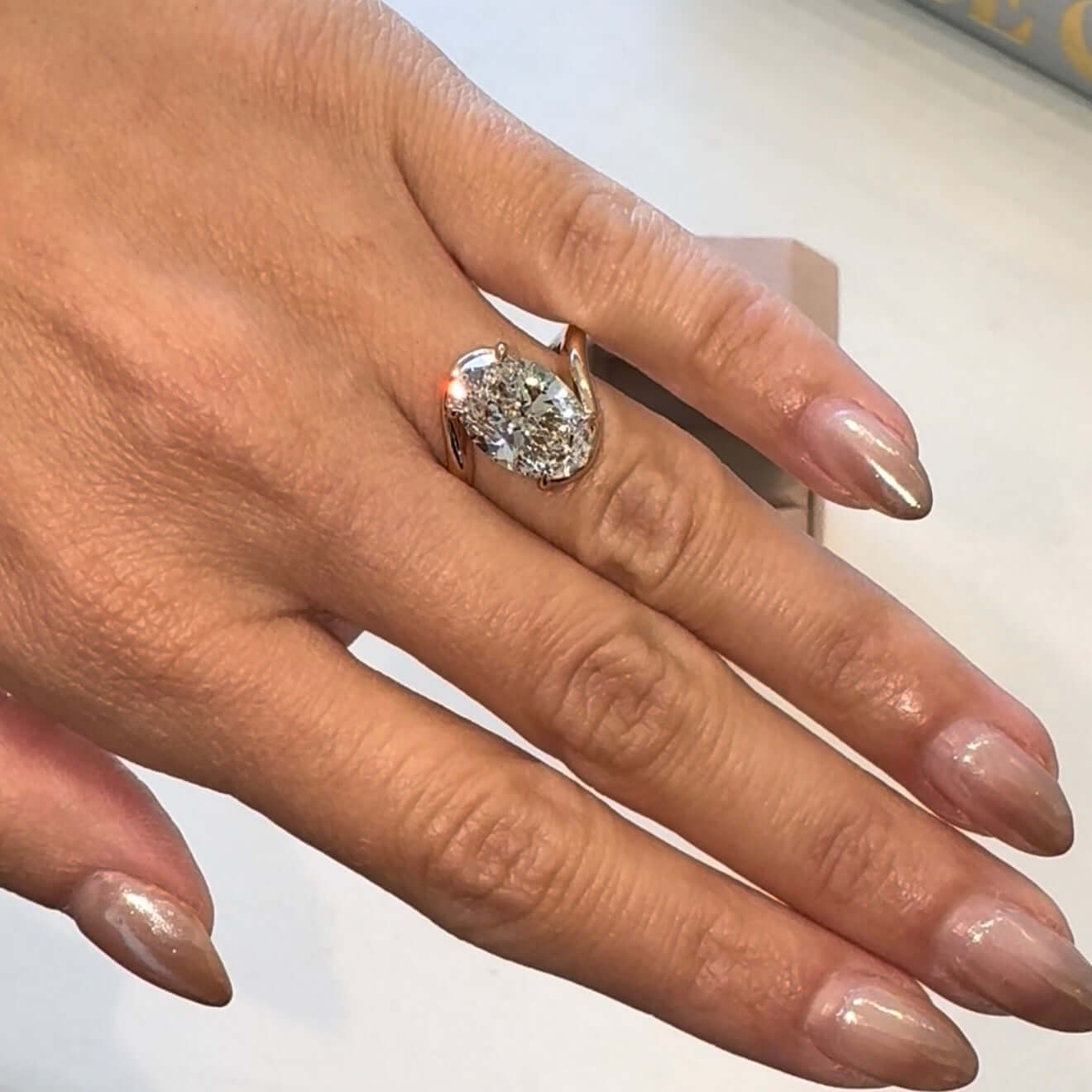 Embrace Lab Diamond Engagement Ring on a hand showcasing its elegant and unique design.