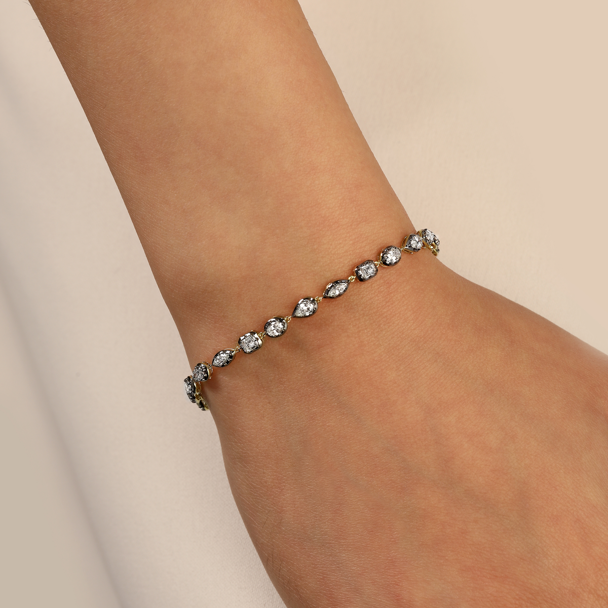 Multi Shape Diamond Black Bezel Tennis Bracelet in 14k yellow gold
