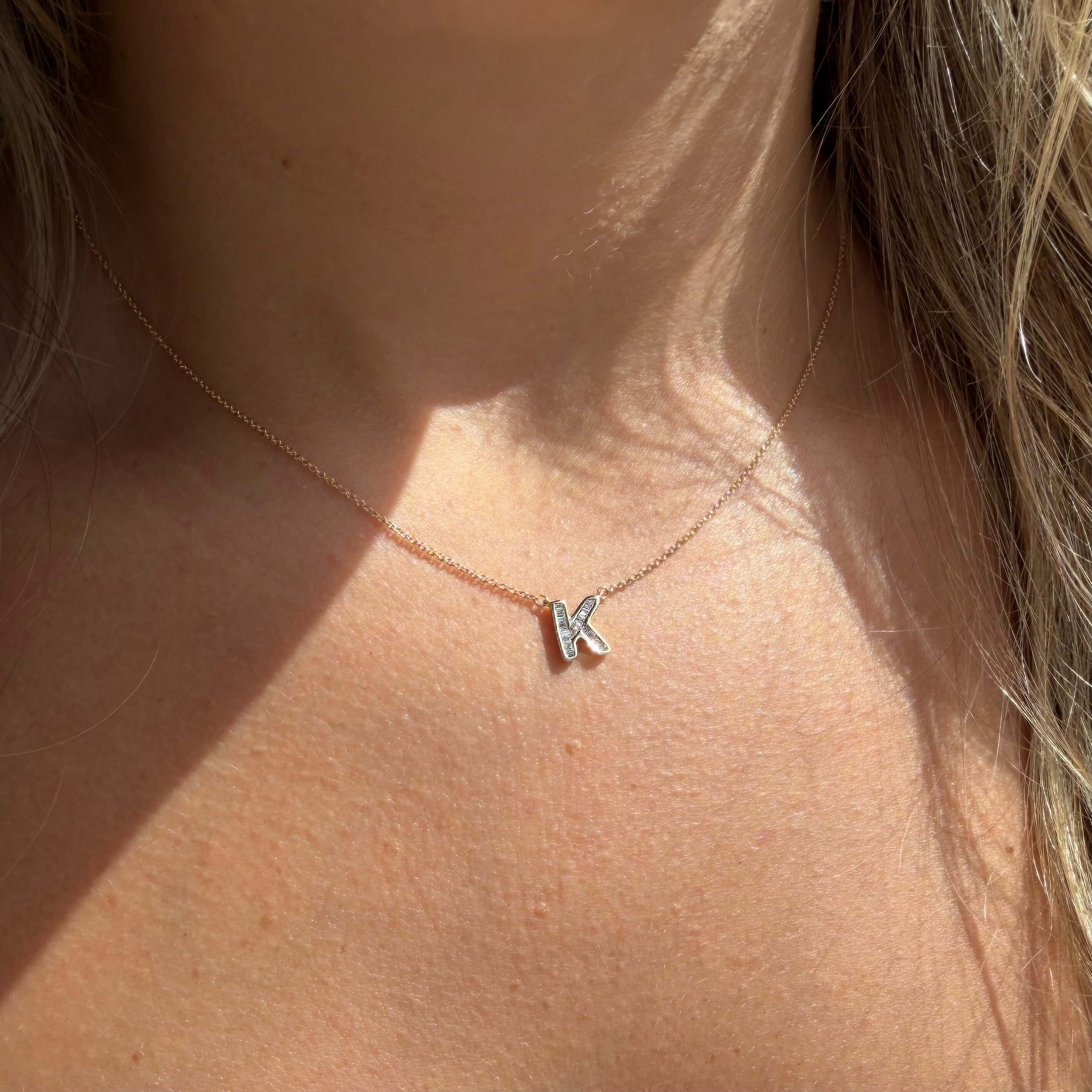 Baguette Diamond Letter Necklace featuring a 'K' charm, ideal for personalizing your jewelry collection.