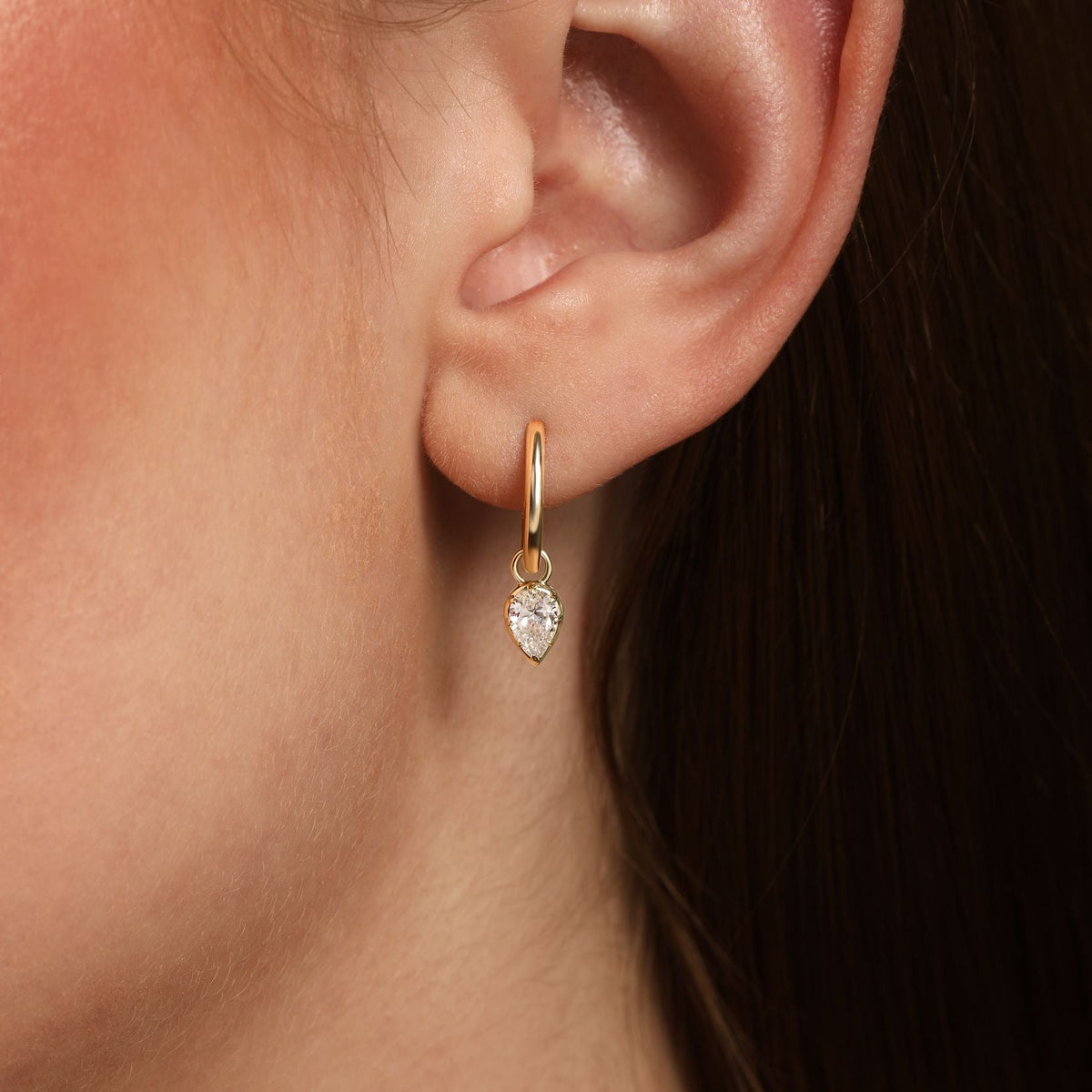 Pear Diamond Drop Huggie Earrings in 14k yellow gold
