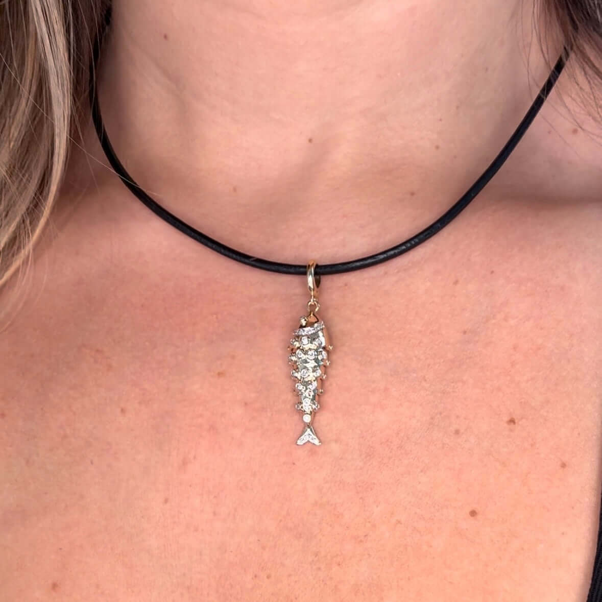 14K Gold Lucky Fish Diamond Necklace Pendant worn on a black choker, featuring sparkling micro pave diamonds.