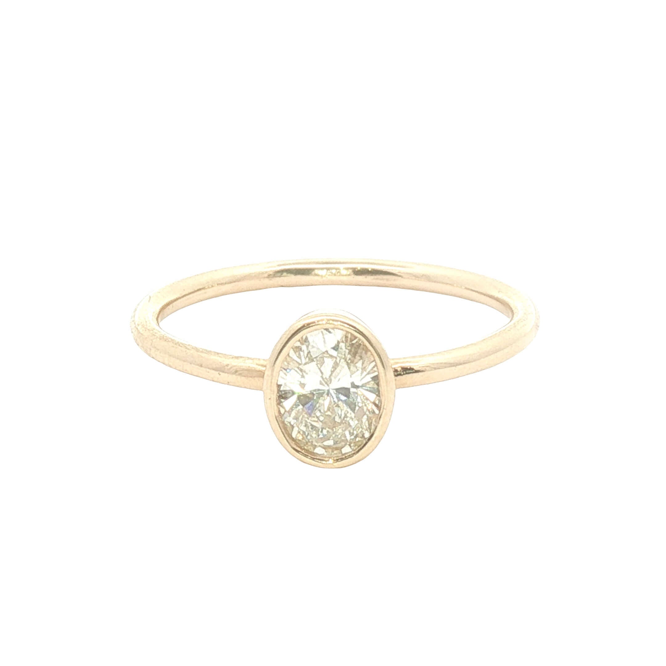 Bezel Set Natural Diamond Solitaire Ring in 18k gold with a secure bezel setting for modern elegance.