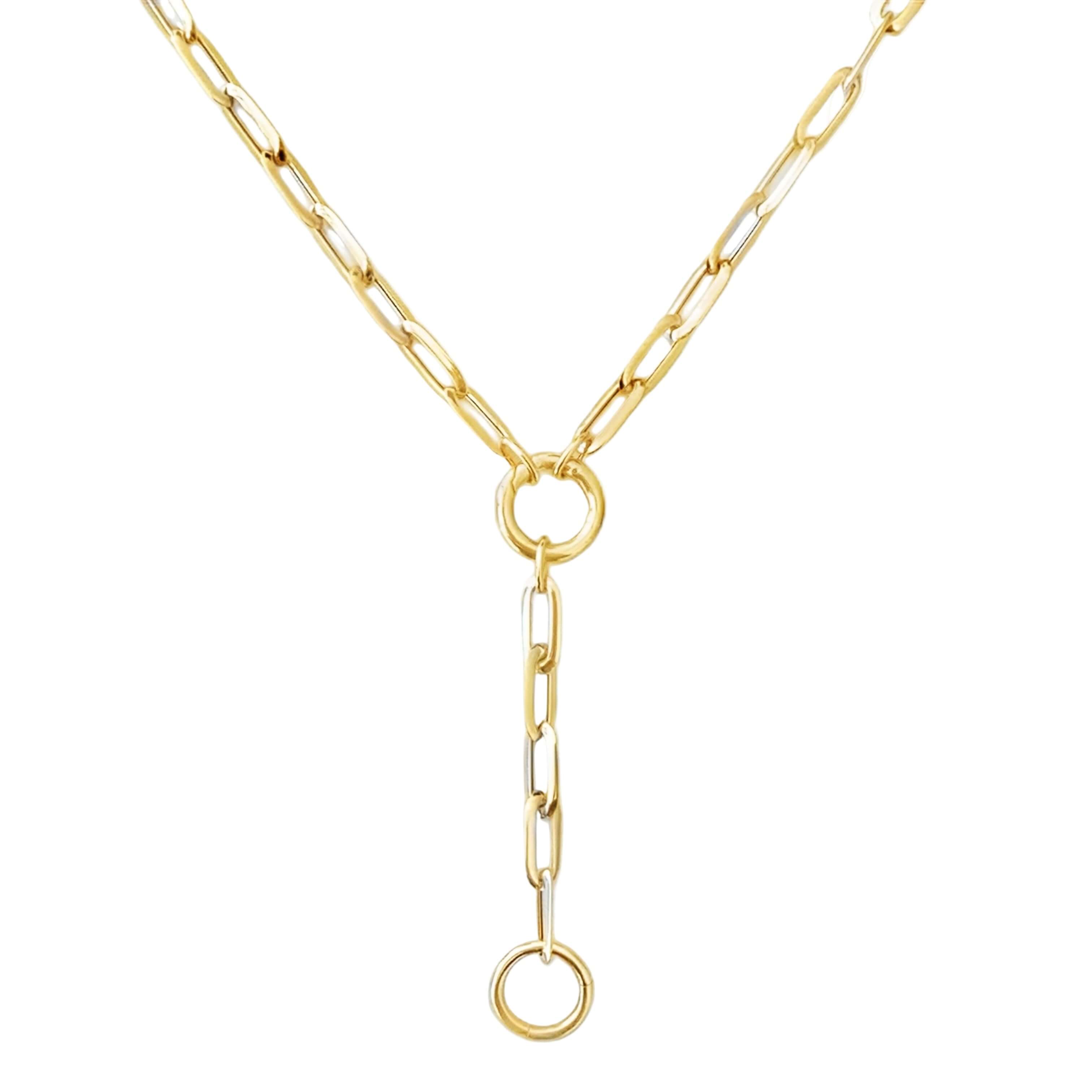 Gold necklace with a unique chain design on a white background