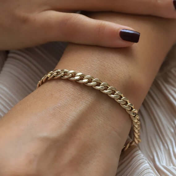 Classic Light Miami Cuban Link Gold Bracelet showcased on a wrist, highlighting its elegant 14K gold craftsmanship.