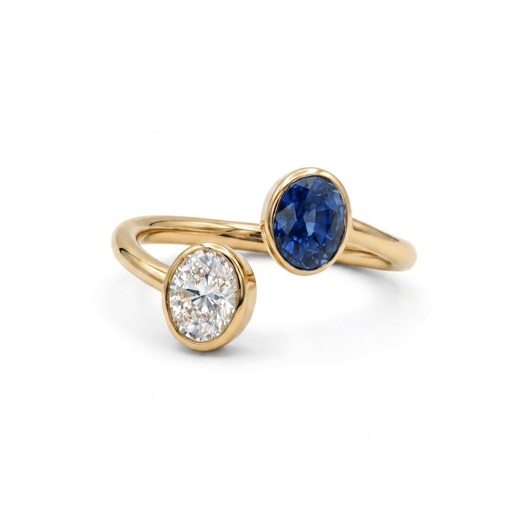Toi et Moi Oval Diamond & Sapphire Wrap Ring featuring a 0.45 carat diamond and a 0.71 carat sapphire in 18K gold.