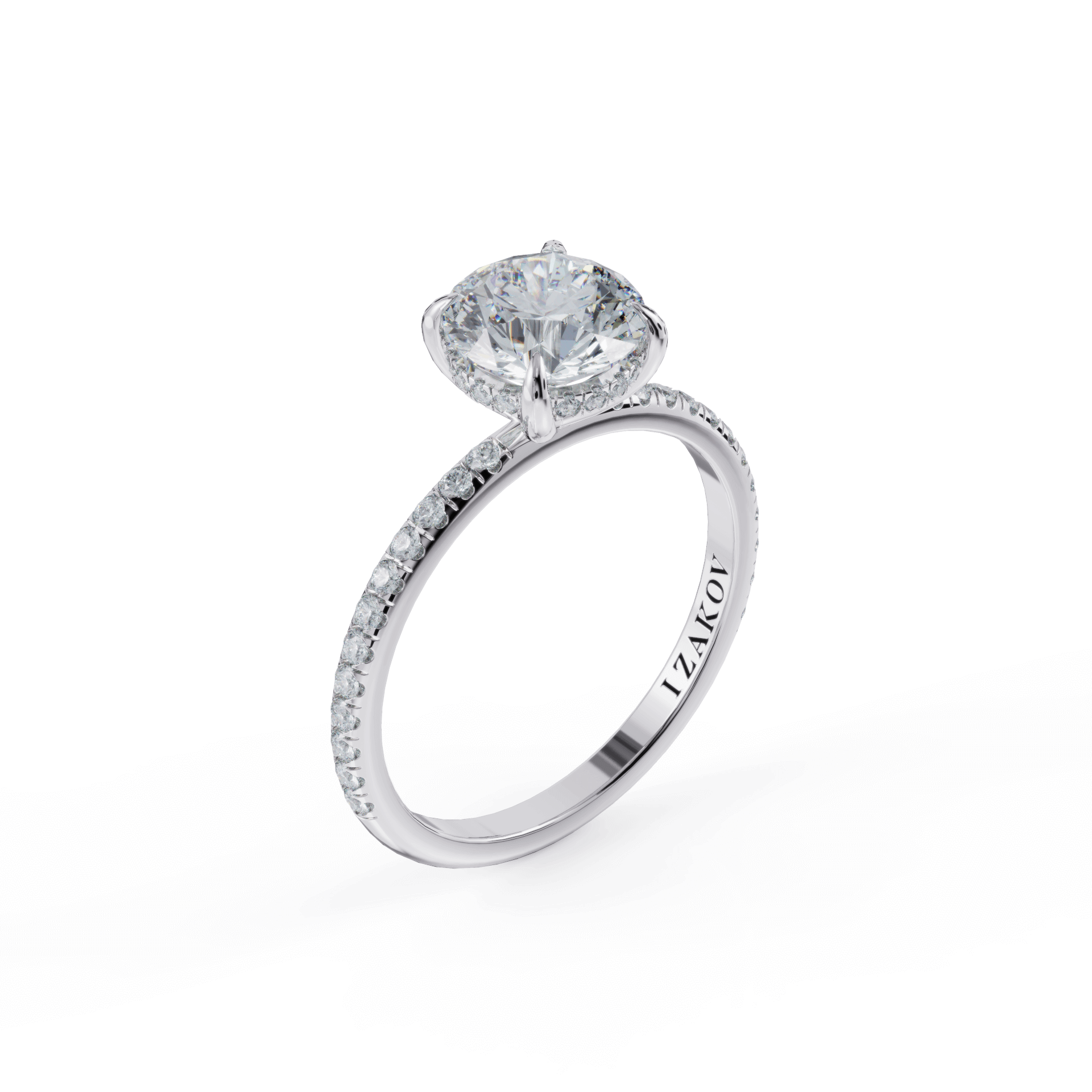 Elegant diamond engagement ring with round solitaire stone and pave band in white gold by I Zakoi Jewelry.