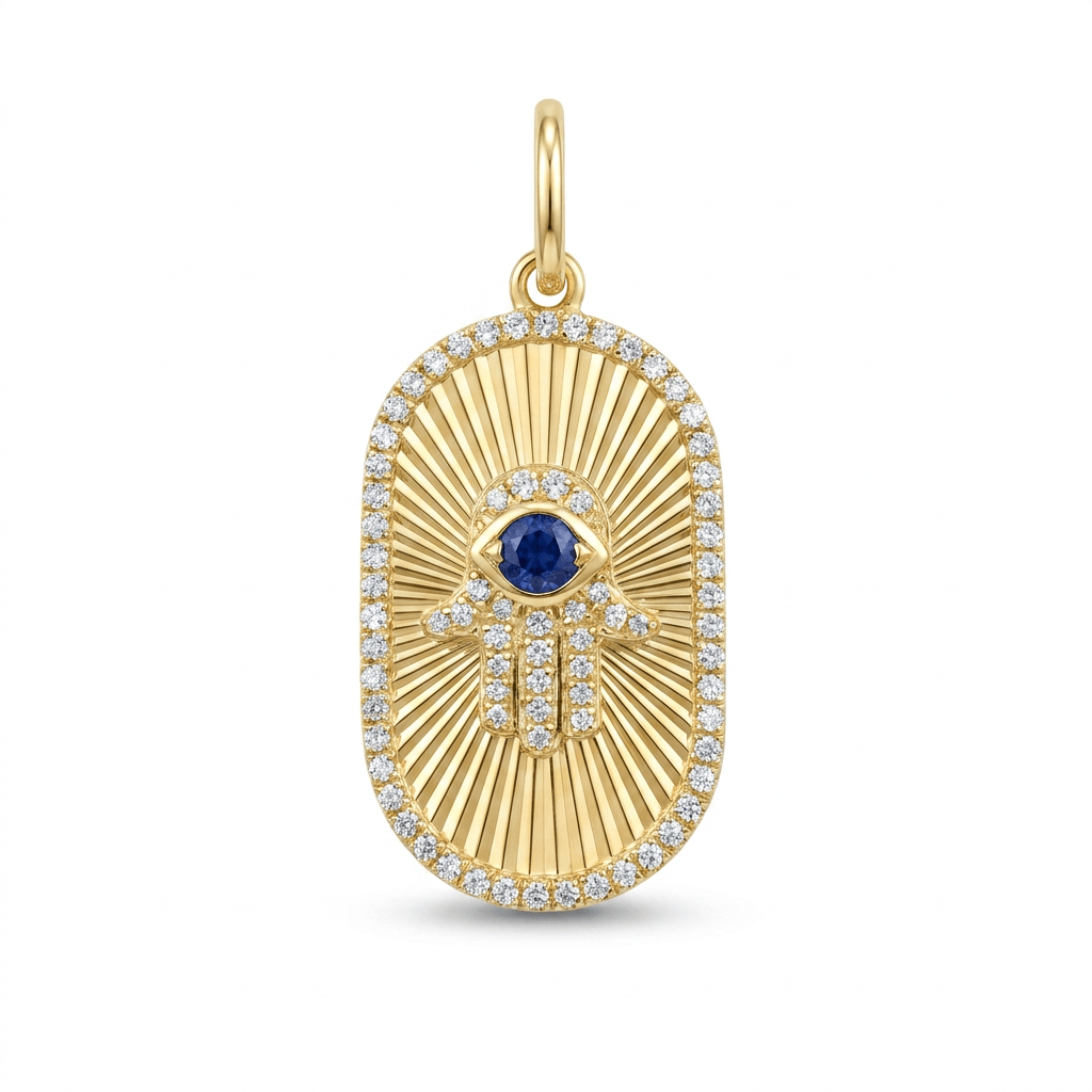 Oval gold hamsa charm with a sapphire in the center and pavé diamonds outlining the hamsa and the oval shape