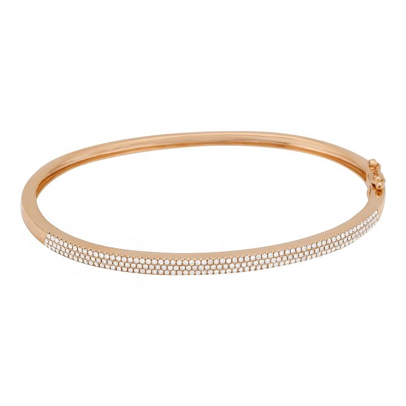 Elegant rose gold bangle with delicate diamond accents by our jewelry brand