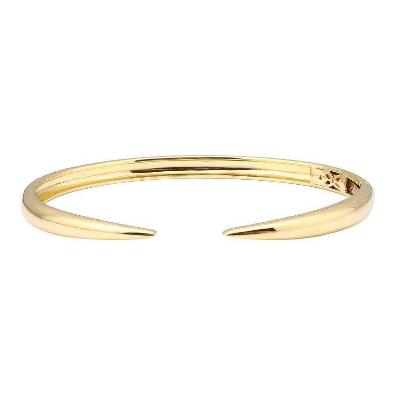 Elegant gold bangle bracelet by our jewelry brand, showcasing contemporary design and refined craftsmanship.
