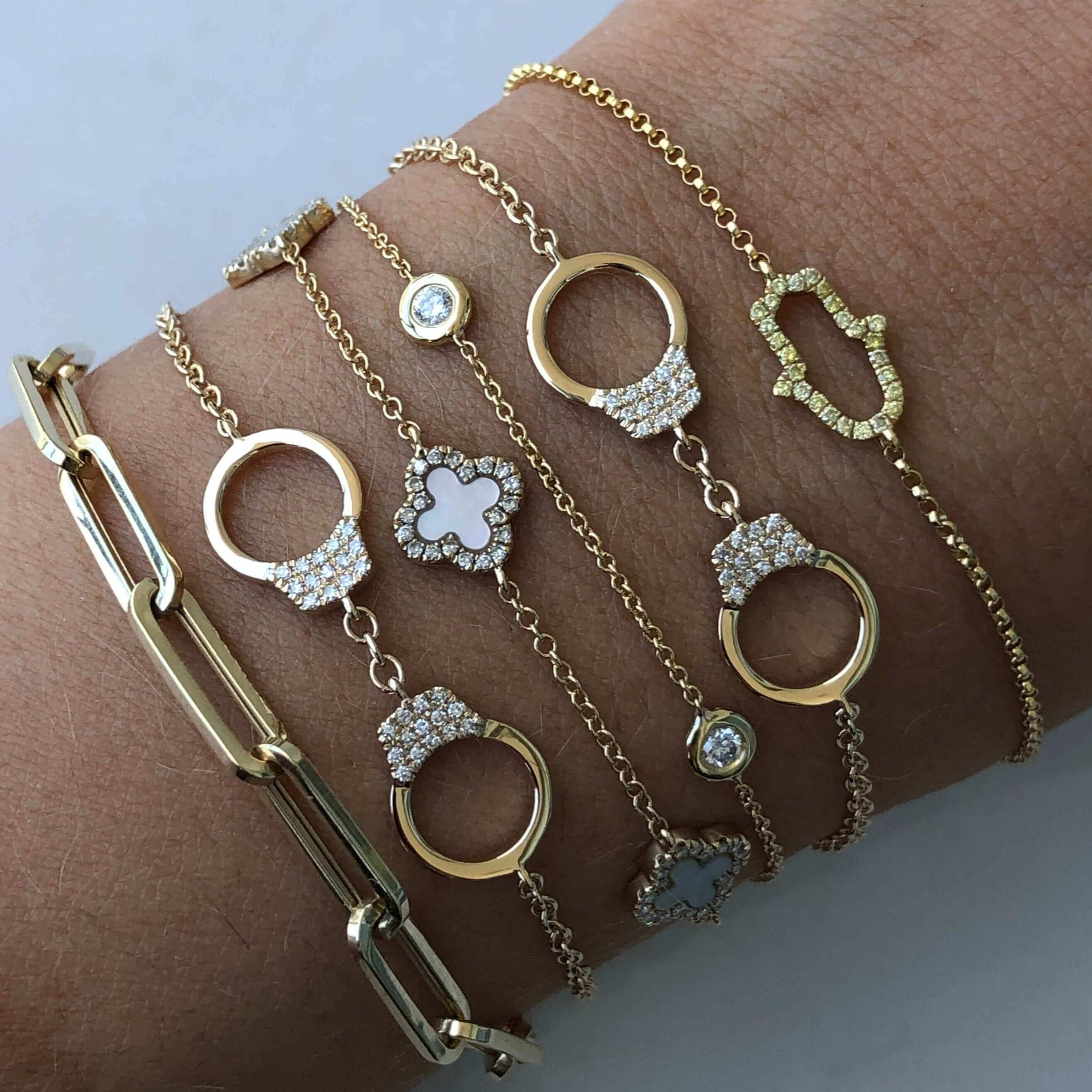 Elegant gold and diamond charm bracelets by our jewelry brand