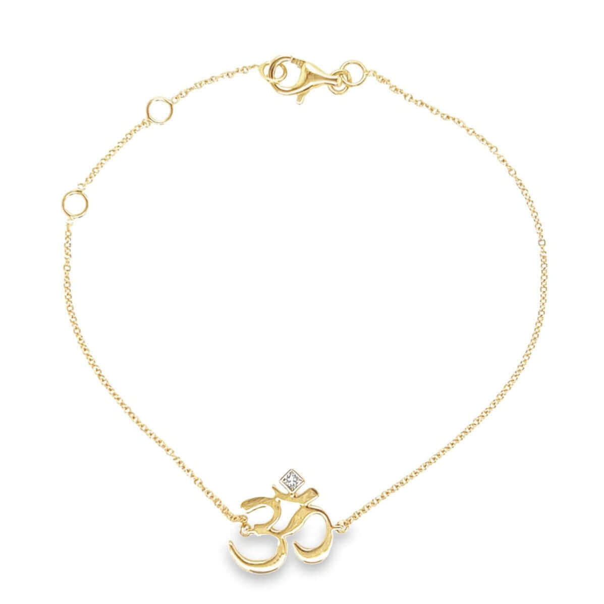 Gold bracelet with Om symbol and diamond detail, elegant jewelry piece from our exclusive collection.