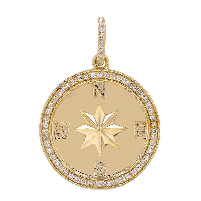 Gold compass pendant with diamond accents from our luxury jewelry collection.