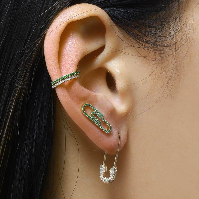 Stylish ear wrapped in green and silver jewelry including ear cuffs and safety pin earrings from our unique jewelry collection.