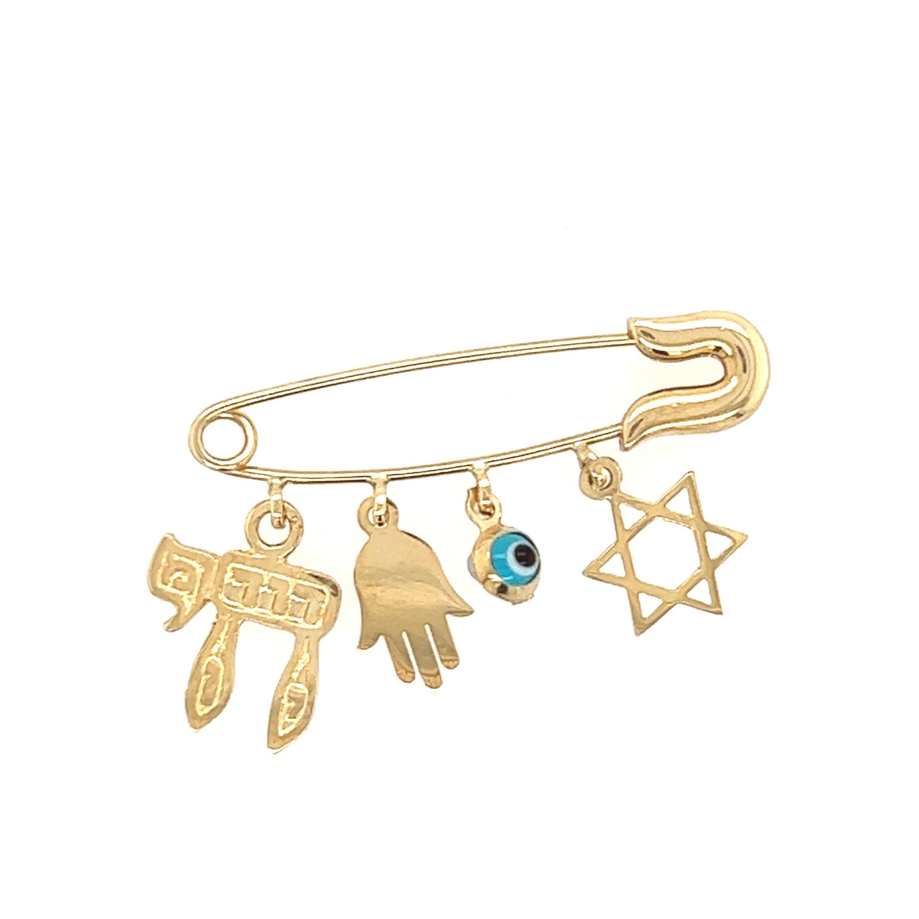 Gold safety pin with Chai, Hamsa hand, Evil Eye, and Star of David charms from our jewelry collection.