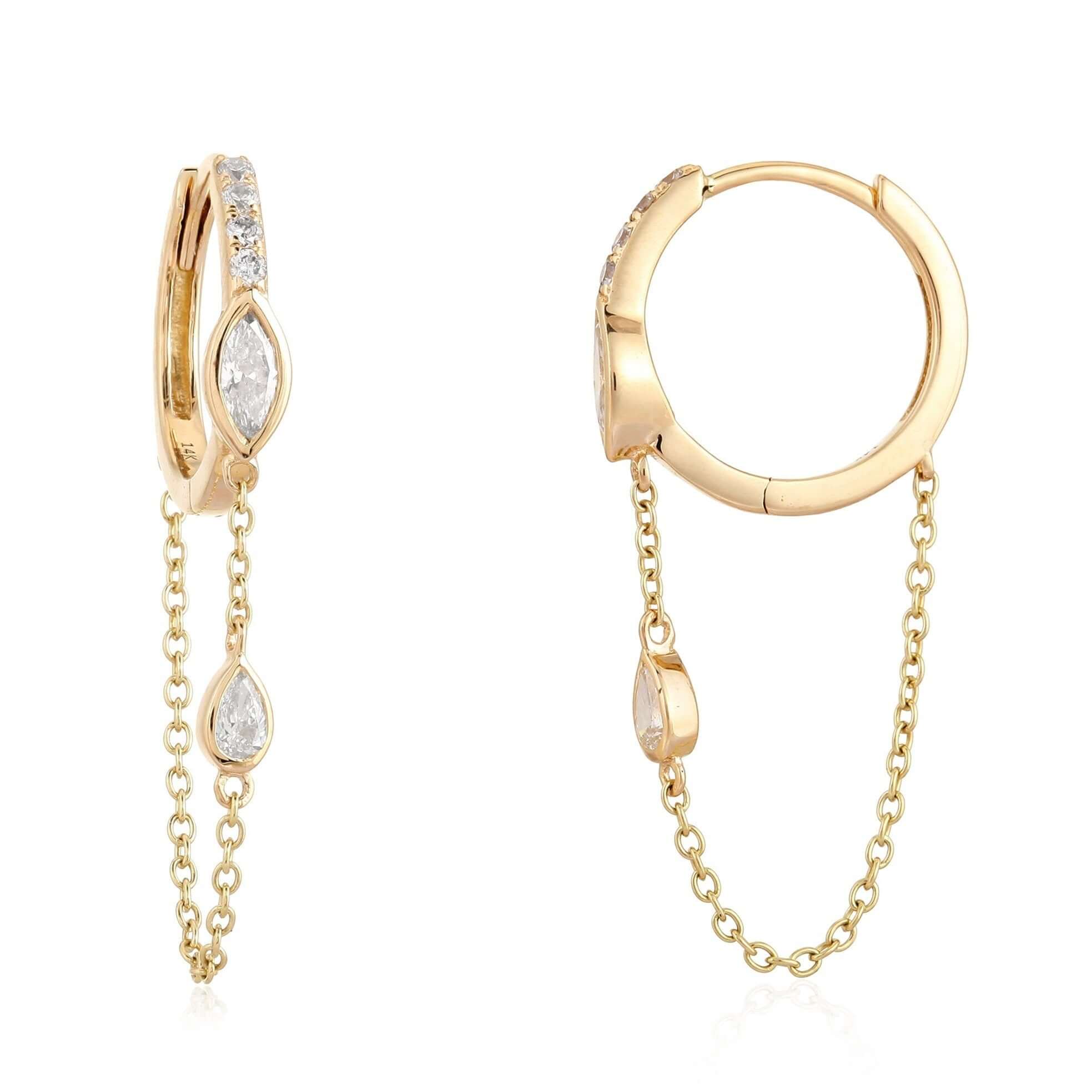 Elegant gold hoop earrings with dangling teardrop diamonds from our luxury jewelry collection