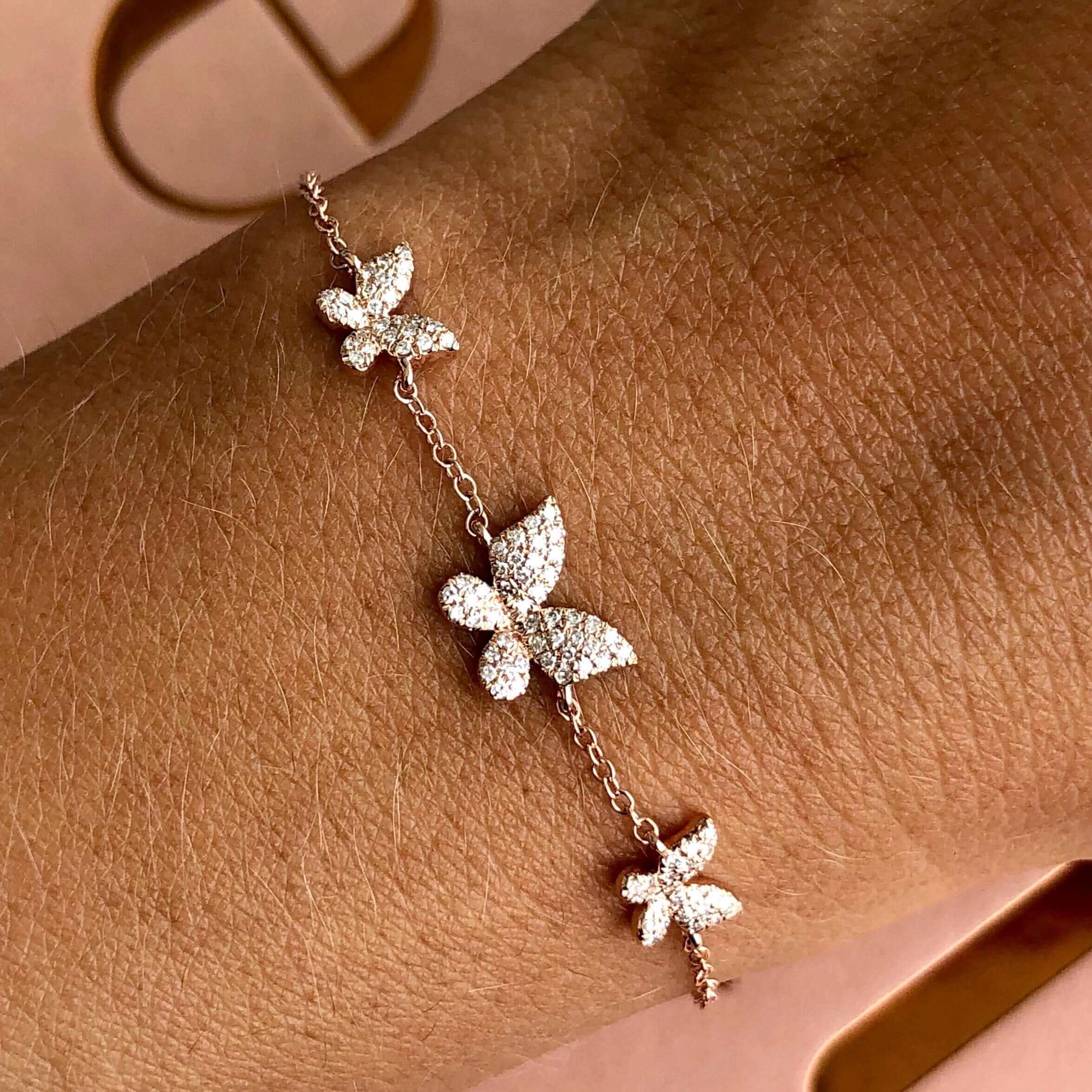 Delicate butterfly bracelet in rose gold with sparkling diamond accents from our jewelry collection.