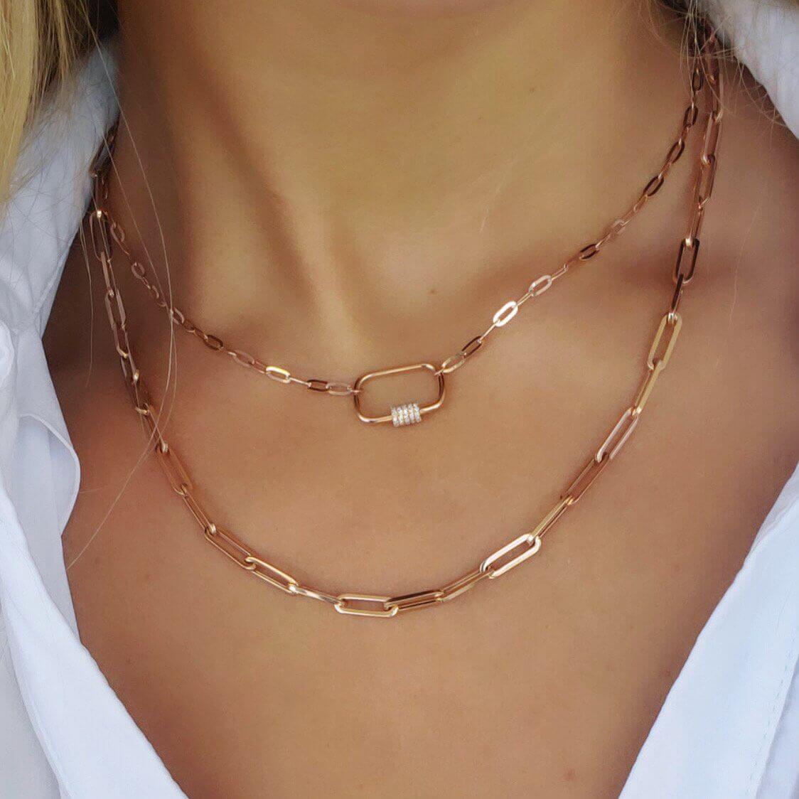 Rose gold chain link necklaces layered on woman's neck, chic and stylish jewelry from our collection.
