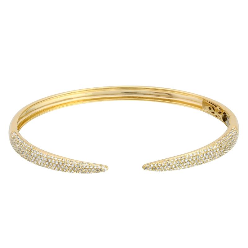 Elegant gold cuff bracelet with intricate diamond detailing from our luxury jewelry collection.